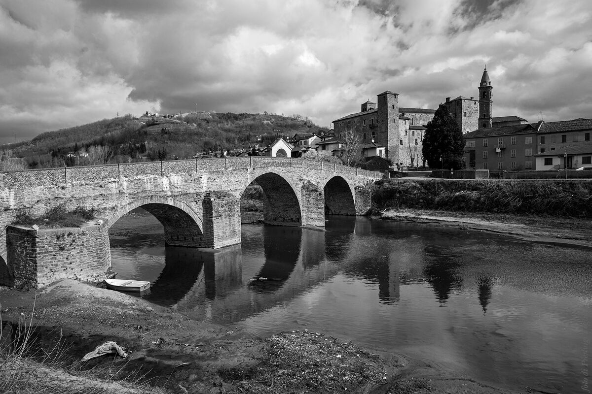 The Romanesque bridge and the castle of Bormida Monastery...