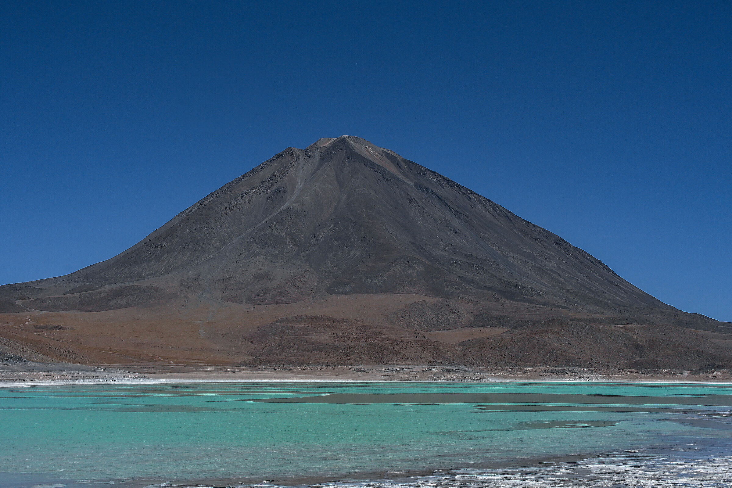 Bolivia. Green Lagoon and Licancabur volcano ...