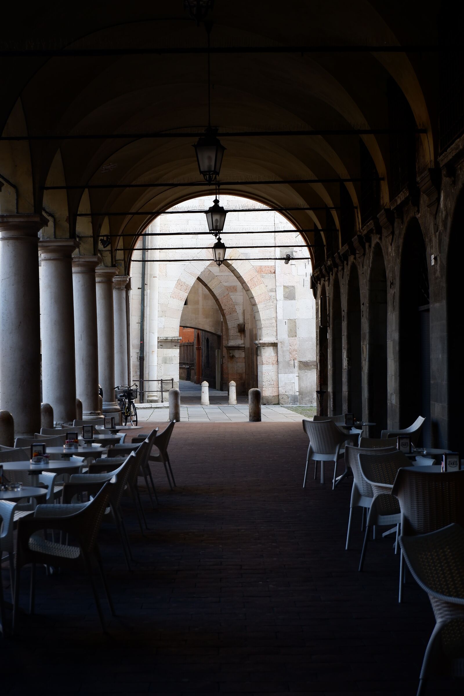 Morning desolation under the arcades of Piazza Grande...