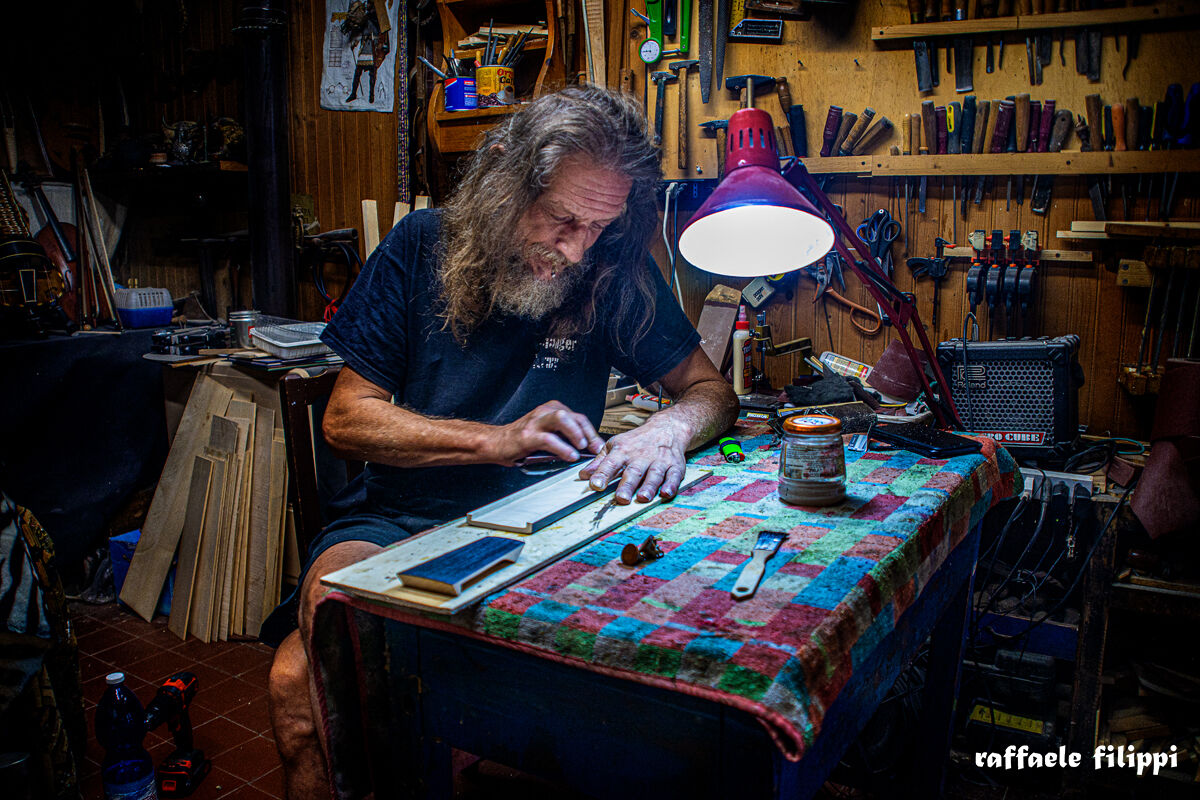 Portrait of Sergio master violin maker, in his workshop...