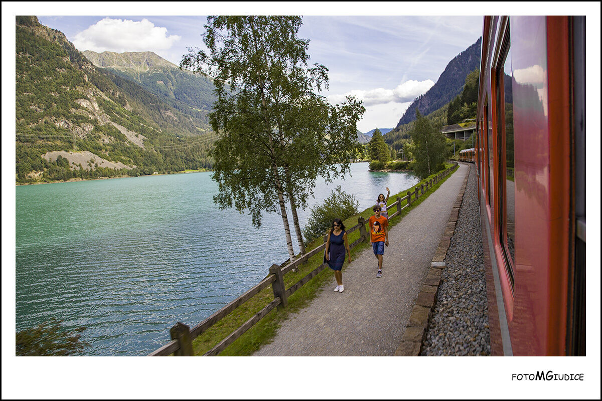 Bernina's red train on Lake Poschiavo...