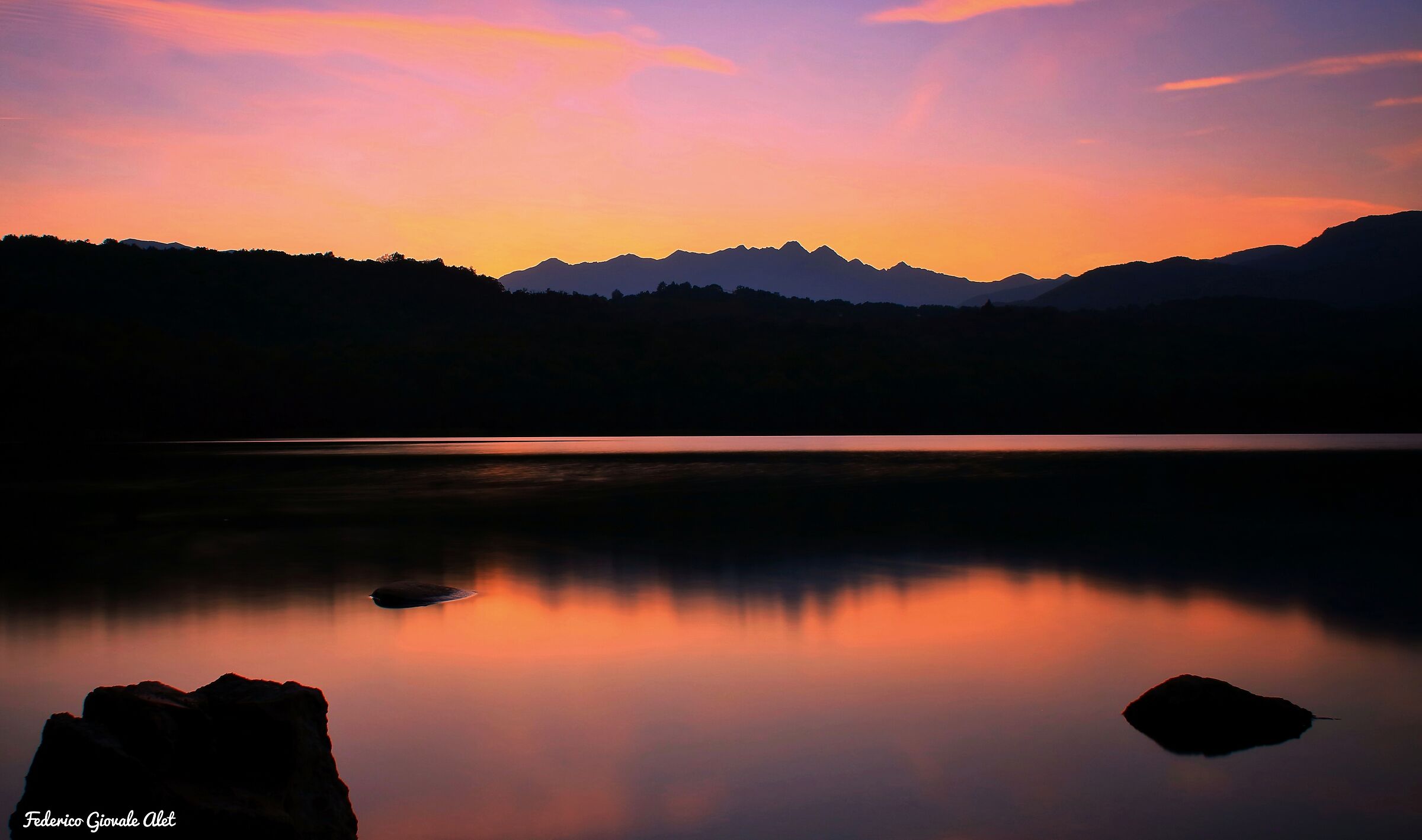 Small lake of Avigliana at sunset ...