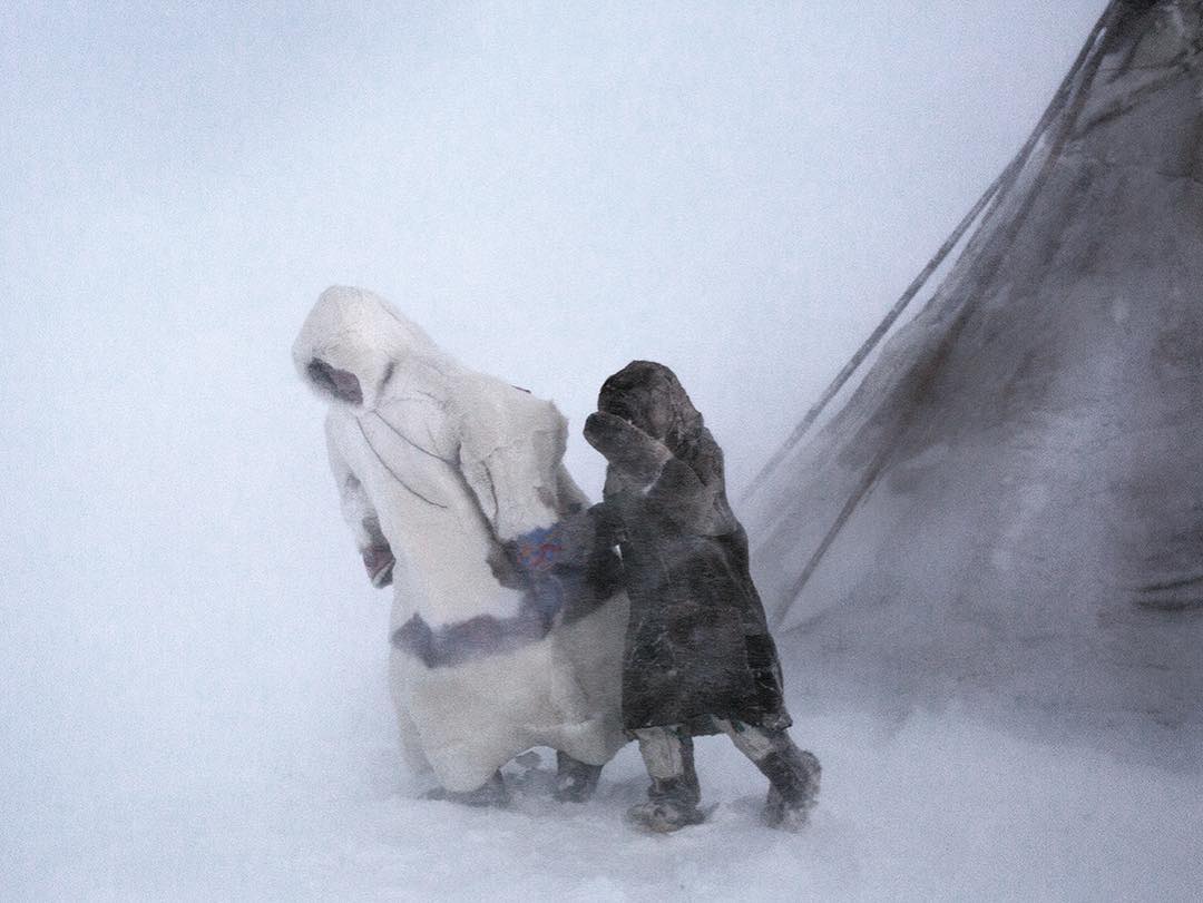 Father and son in the blizzard. Yamal, Siberia...