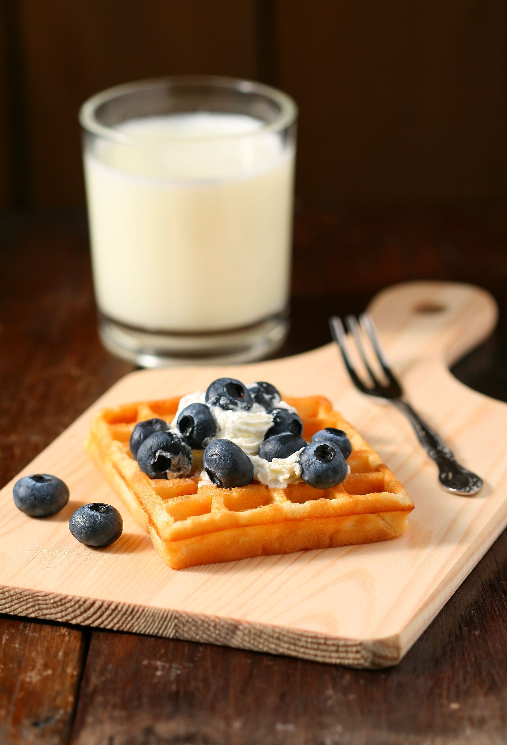 Blue berry with whipped cream on waffle...