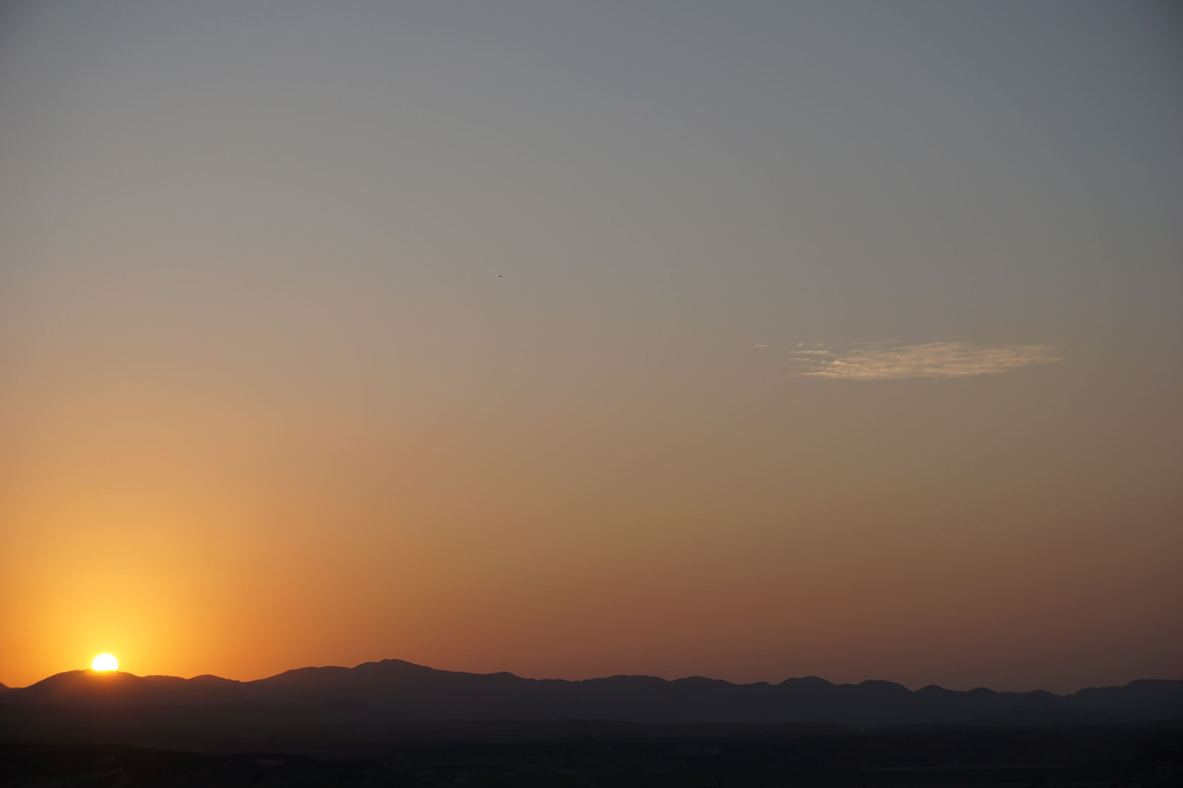 Sunset over rocky desert...