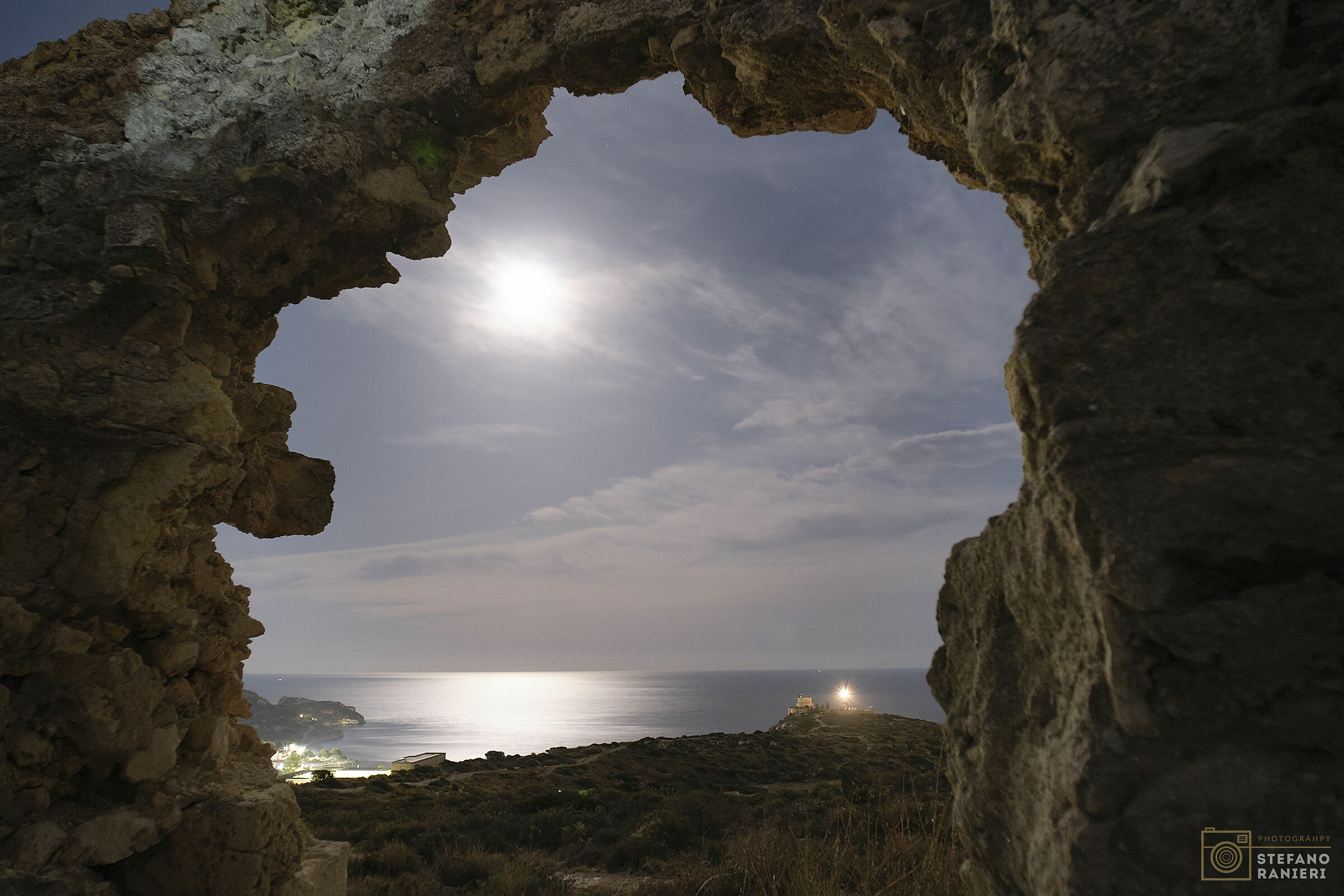Window on the lighthouse under the moon...