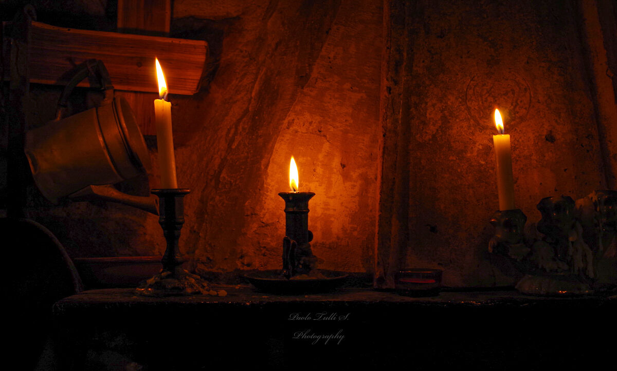By candlelight.......