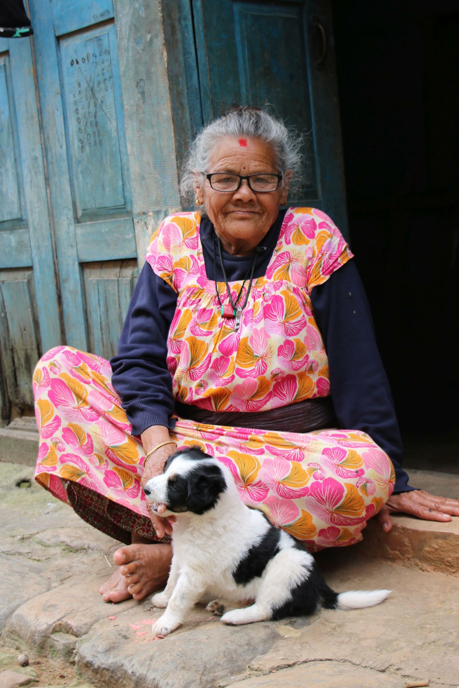 Nepalese granny with puppy...
