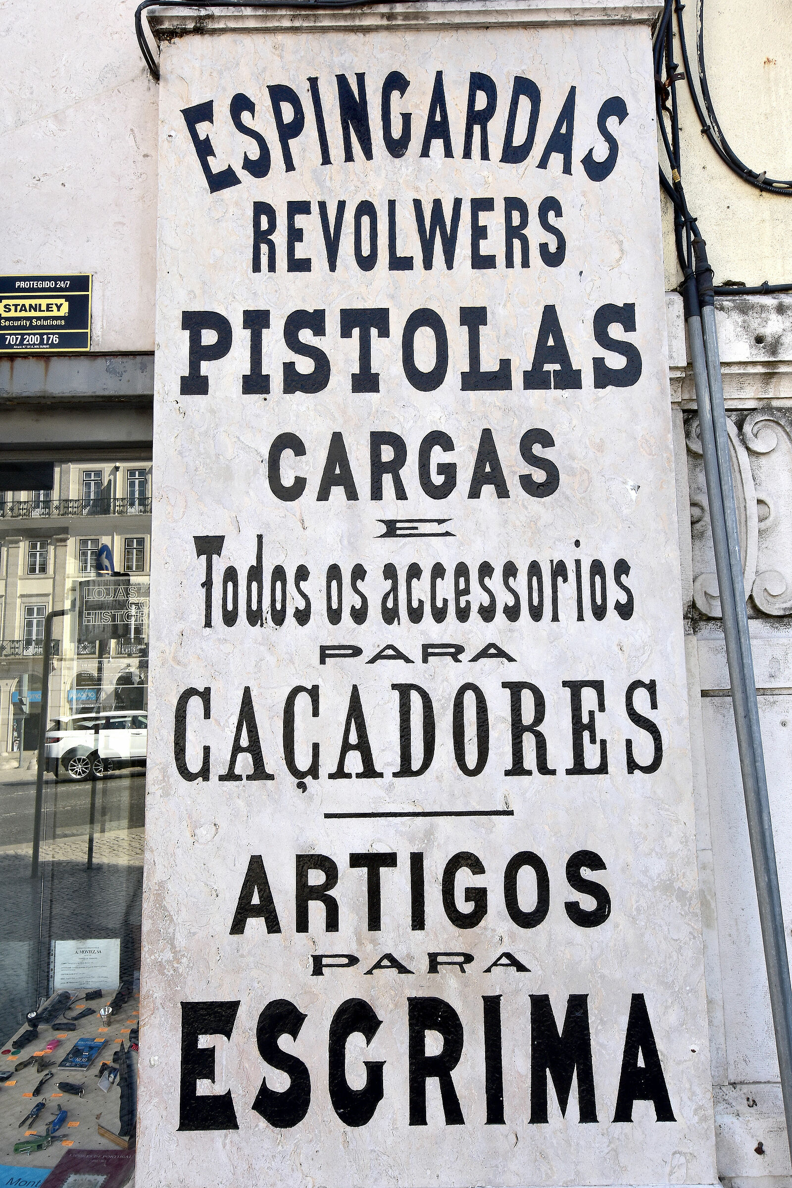 Lisbon,P.zaDom Pedro IV, ancient sign of a gunman...