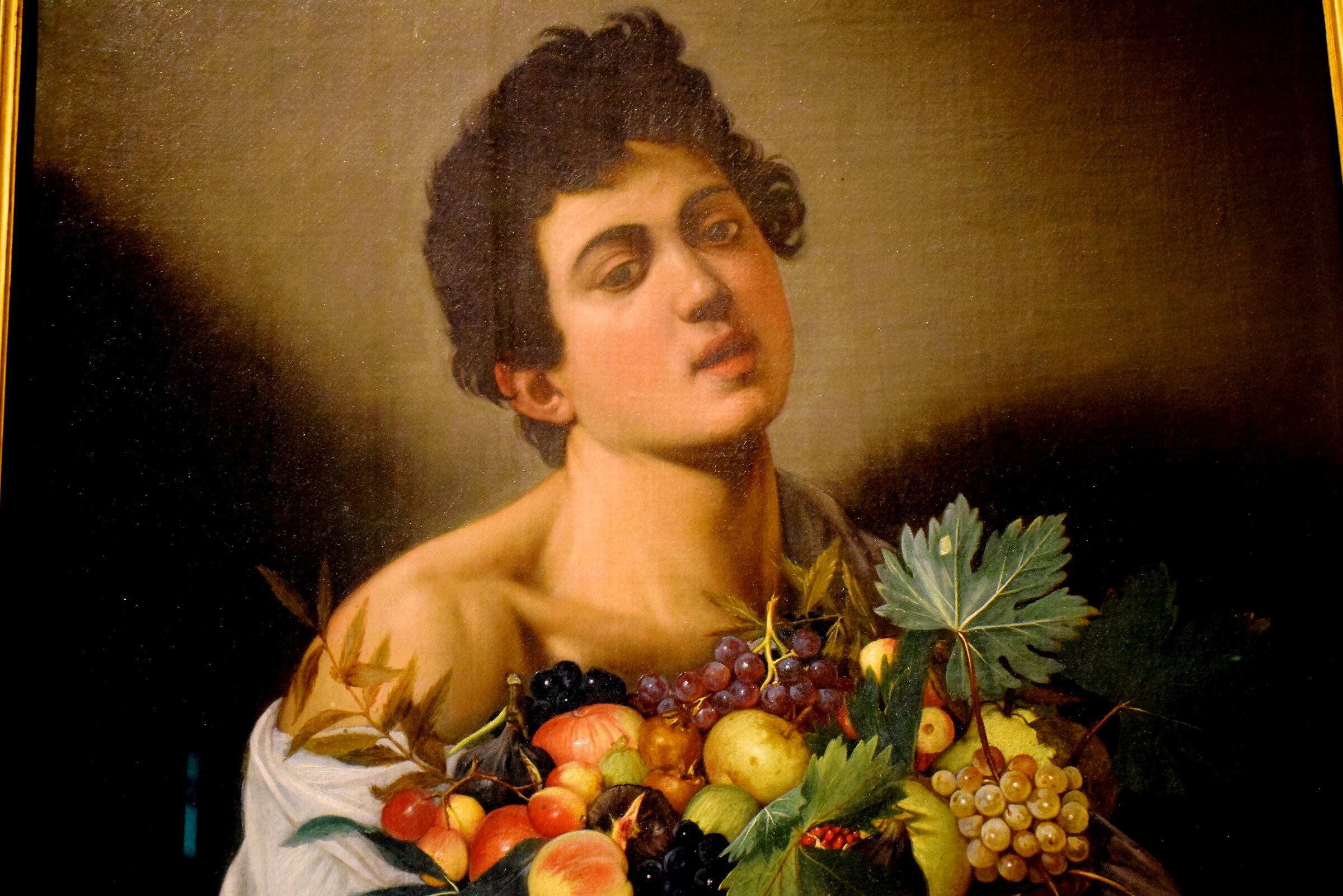 Caravaggio "Giovane con canestro di frutta"...