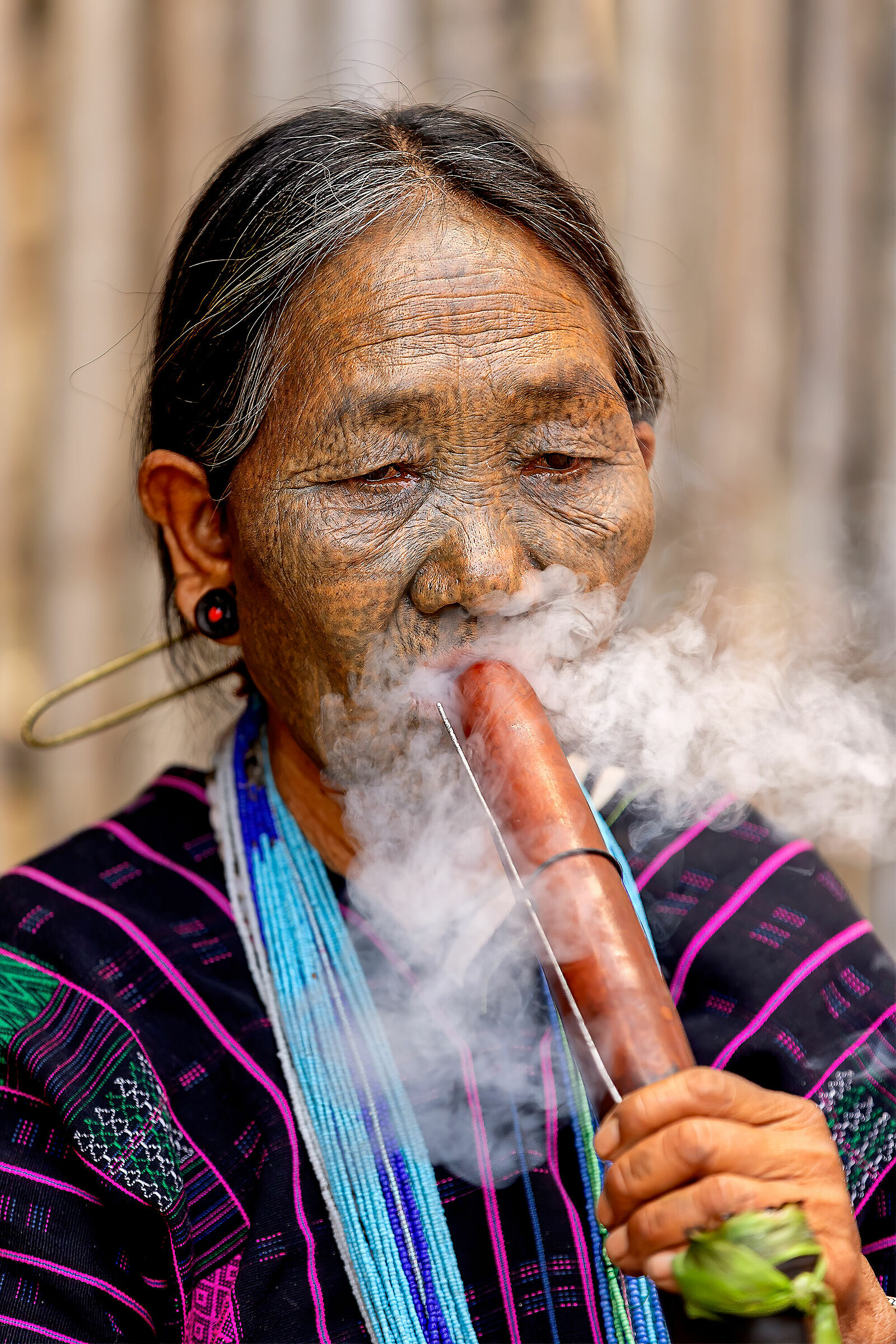 Chin woman smoking pipe...