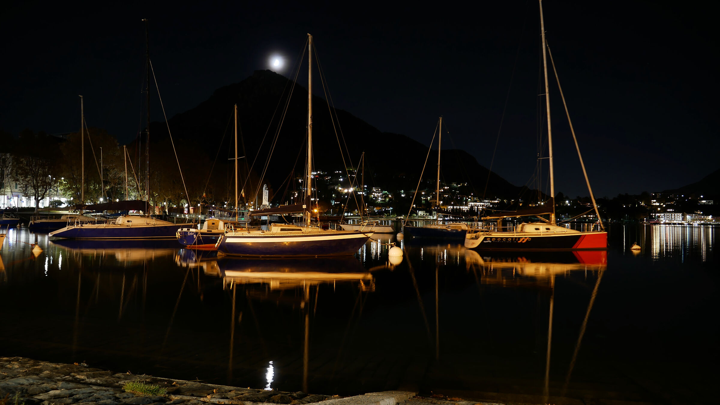 Lecco, lakeside promenade with moon...