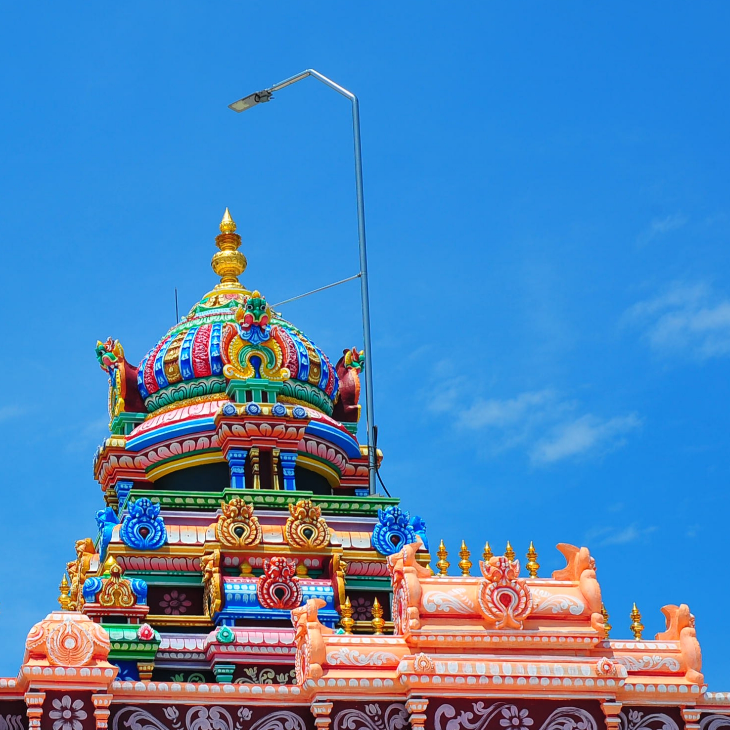 Hindu temple top against blue sky...