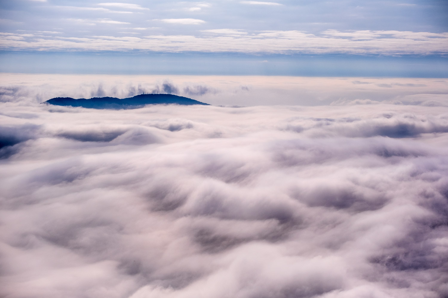 Sea of clouds with island under Mount Baldo...