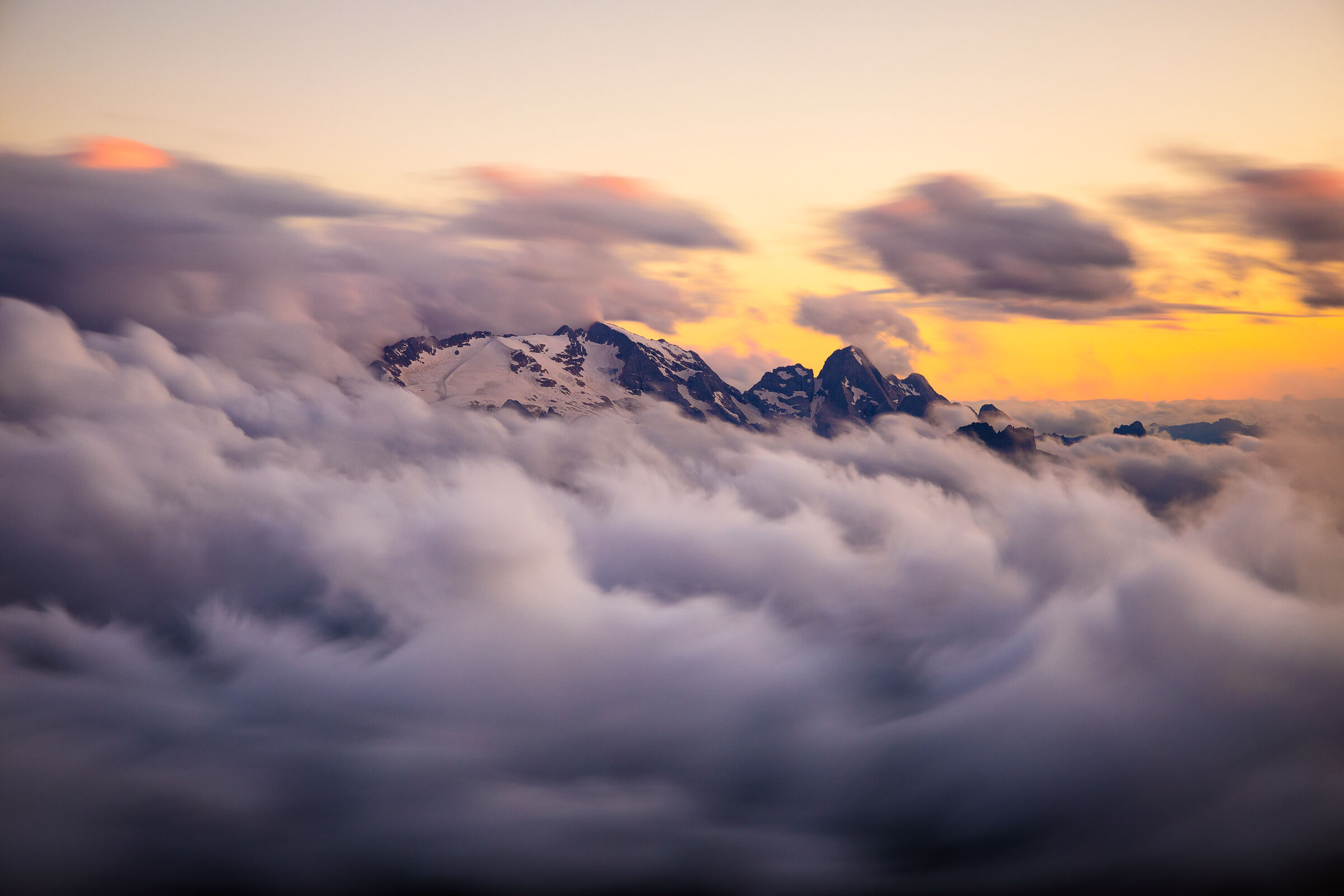 Marmolada emerges from the sea of clouds...