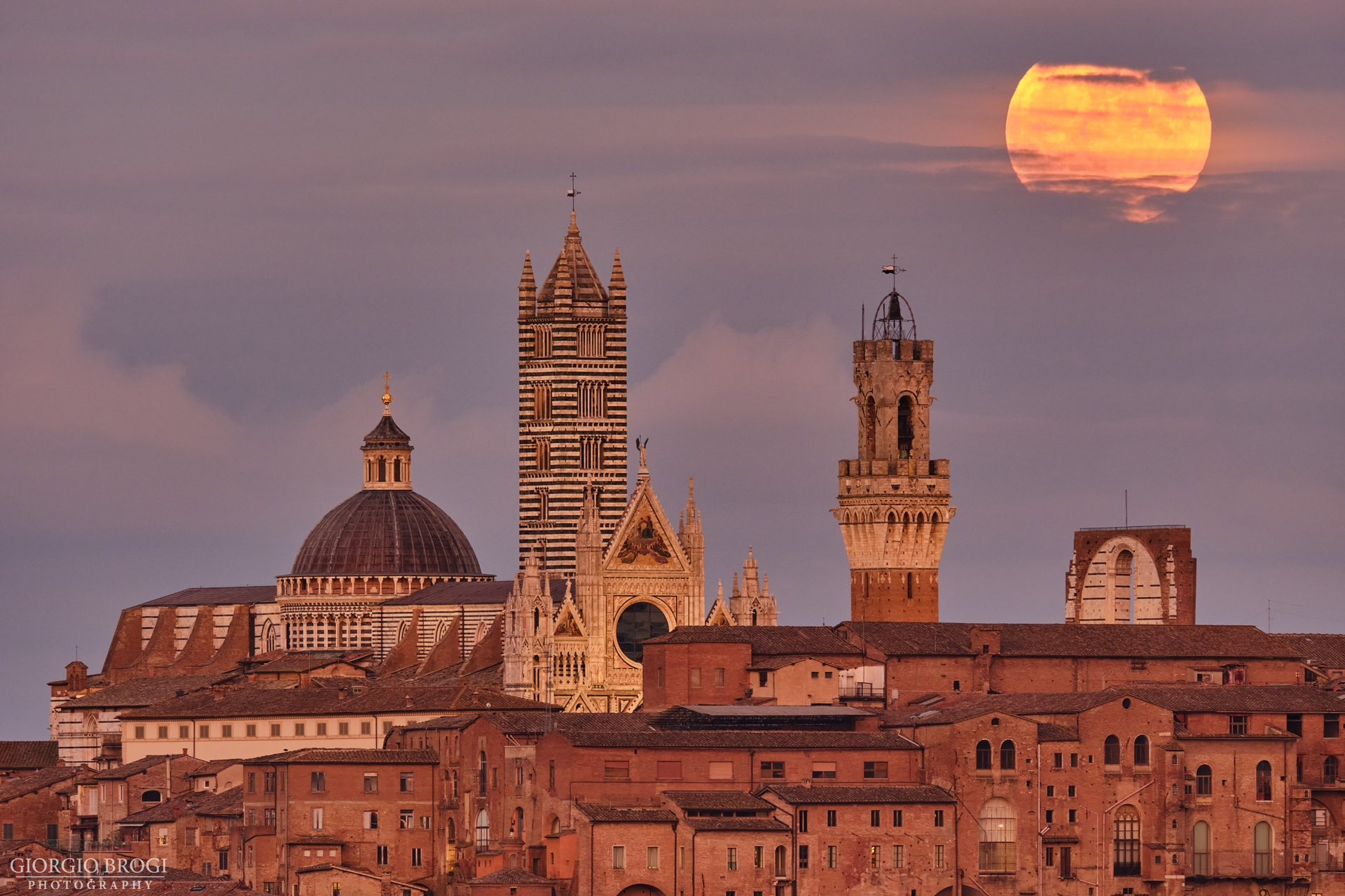The full moon shines over Siena...