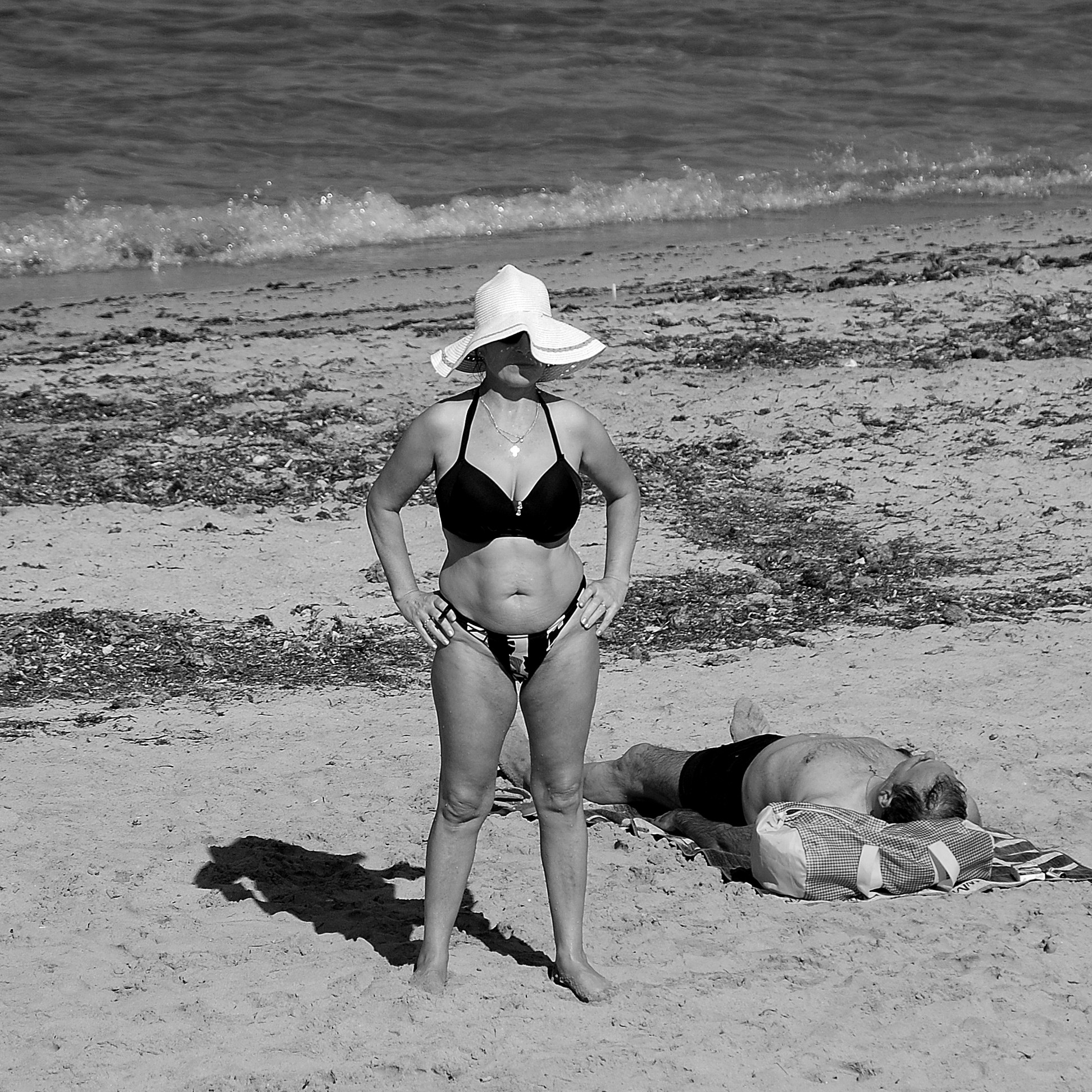Be careful, walk away: husband lying in the sun. ...